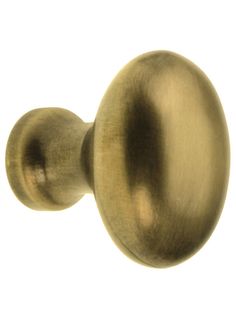 an antique brass door knob on a white background