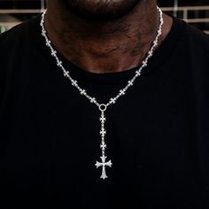 Introducing the Flared Cross Rosary Chain- a modern twist on a classic style. This 14k White Gold piece features intricate flared gothic crosses along an iced out rosary chain embedded with hand-set stones. Perfect for anyone who wants to stand out in the crowd, this rosary will immediately have all eyes on you. This product is guaranteed for life - GLD will repair the item should you experience any defects in craftsmanship or breakage. Specifications - Length: 18-20" Adjustable - Width: 8mm - W Streetwear Jewelry: Cross Pendant Chain, Streetwear Jewelry With Cross Pendant Chain, Streetwear Cross Pendant Chain Jewelry, Cross Rosary, Gothic Crosses, Rosary Chain, Vermeil Jewelry, Gold Piece, Custom Earrings