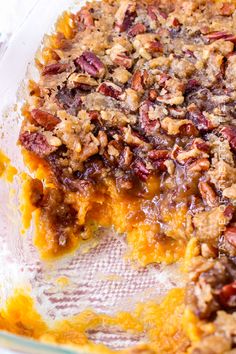 a casserole dish with pecans and other toppings