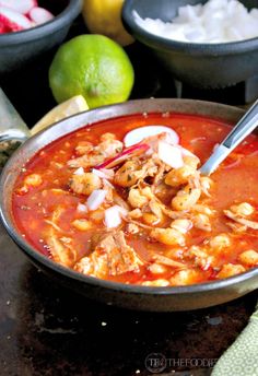 a bowl of soup with meat and vegetables in it