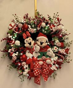 a christmas wreath with mickey and minnie mouses