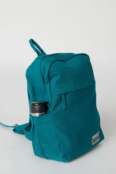 Looking for a sustainably and ethically made backpack for college, work, travel, hiking or other outdoor activities? Our spacious and durable Earth Backpack is the workhorse of our line, built for everyday carry with heavy-duty 14-oz. certified organic cotton canvas that is made in a Fair Trade Certified™ Factory. The generous main compartment is divided with a no-fuss sleeve for your laptop and one small interior pocket to keep things organized. Two water bottle sleeves and the large zippered e Backpacks For College, Backpack For College, Sustainable Backpack, Soap Packing, Handmade Backpacks, Feeding America, College Work, Bottle Sleeves, College Backpack