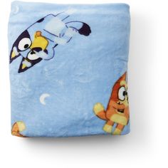 a blue pillow with cartoon characters on it