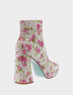 Make a statement with the sparkly DELLA all-over rhinestone platform booties. These stunning booties feature an all-over sparkly design with a classic Betsey Blue bottom for a touch of glam. Manmade rhinestone embellished booties Synthetic lining/sock Betsey Blue synthetic sole 4 inch heel height .75 inch platform Approx. 10 inch ankle circumference Imported Women's Booties, 4 Inch Heels, 10 Inch, New Shoes, 4 Inch, Casual Fashion, Heel Height, Stockings, Heels