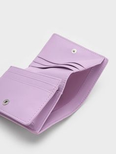 This wallet is the perfect accessory for anyone who wants to add a touch of femininity and elegance to their everyday look. The quilted design creates a classic and timeless feel, while the beautiful lilac finish adds a fresh and modern touch. Despite its compact size, this wallet has multiple compartments to keep your essentials organised. The snap closure ensures that everything is kept safe and secure. Short Wallet, Mini Short, Charles Keith, Mini Wallet, Lilac, Wallet, Design