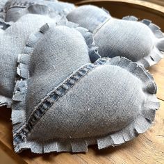 several pieces of fabric sitting on top of a wooden table