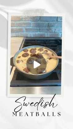 a pan filled with food sitting on top of a stove next to a brick wall