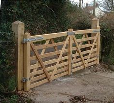 a wooden gate with metal bars on it