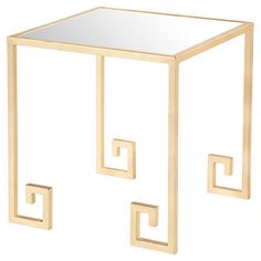 a gold metal and glass side table with an abstract design on the top, against a white background