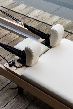 a white chair sitting on top of a wooden floor