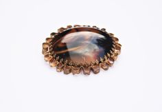 "A beautiful large retro brooch. A marbled brown porphyr glass cabochon has been claw set into a gold tone casting, to create this bold statement piece.  Measurements: 1.96\"/50mm diameter Condition: Good condition, with age related discolouration to the plating throughout - please take a look at the photographs. All purchases are sent out securely boxed, with an organza gift bag! Thanks for looking :) If you would like to see more vintage costume jewellery, visit the Retrorox Shop: https://www. Mid-century Cabochon Brooch For Gift, Mid-century Cabochon Brooch Gift, Mid-century Cabochon Brooches For Gifts, Vintage Brown Jewelry Brooch, Vintage Brown Brooch Jewelry, Brown Brooch Jewelry Gift, Brown Jewelry Brooch For Gifts, Vintage Brown Brooches For Gifts, Vintage Brown Brooch For Collectors