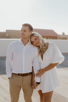 a man and woman standing next to each other