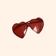 a pair of heart shaped sunglasses on a white background