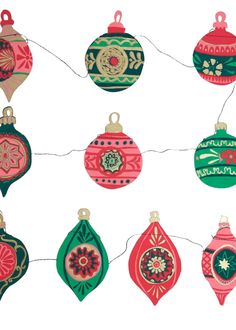 an assortment of christmas ornaments hanging on a string