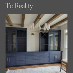 a large room with blue cabinets and white walls