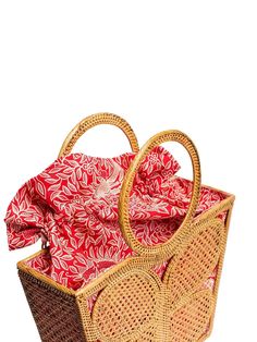 The Ata Butterfly Tote Bag stands out with its whimsical butterfly design. It adds a touch of fun and elegance to your beach ensemble, making it a fashion statement. When you open the bag, you'll be greeted by a bright paisley print fabric lining that peeks through the wicker folds. This interior design not only adds a pop of color but also creates a cheerful and beachy atmosphere. Crafted from rattan, this handbag is the epitome of summer chic. The natural texture of rattan perfectly complement Butterfly Tote Bag, Paisley Print Fabric, Whimsical Butterfly, Bag Stand, Summer Chic, Butterfly Design, Natural Texture, Print Fabric, Paisley Print