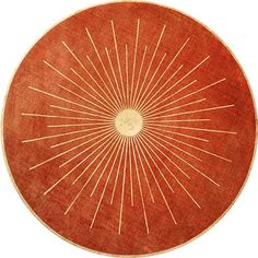 an orange and white rug with sunbursts in the center on a white background