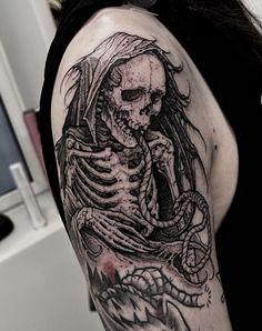 a woman with a skeleton tattoo on her arm