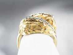 A bypass of rich, high 18 karat textured gold gives this ring an organic look, like feathers or petals wrapping about the finger! Bright diamonds of excellent color glitter at the centers, nestled securely in the gold. Intended to be worn every day, this piece is designed for comfort, as well as style, and will work well stacked with other rings! Metal: 18K Yellow Gold Gem: 18 Diamonds totaling .26 Carats Gem Measurements: 1.5 mm, Round Ring Size: 4.75 Marks: "18K" Stamped on the inside band Cocktail Ring Diamond, Yellow Gold Sapphire Ring, Rings Metal, Diamond Cocktail Ring, Bypass Ring, Cameo Ring, Diamond Cocktail Rings, Gold Diamond Ring, Diamond Anniversary