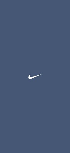 the nike logo is shown against a blue sky with no clouds in sight behind it