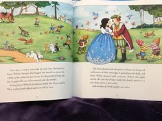 an open children's book with pictures of people and animals