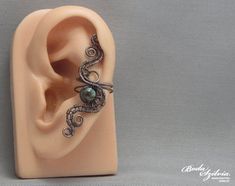 copper ear cuff 'mother earth' turquoise ear cuff | Etsy Bohemian Copper Wrap Earrings, Unique Handmade Copper Ear Cuff, Handmade Unique Copper Ear Cuff, Handmade Copper Ear Cuff With Unique Style, Unique Adjustable Wire Wrapped Cartilage Earrings, Adjustable Silver Copper Wrap Earrings, Adjustable Silver Wrap Earrings In Copper, Wrap Earrings, Silver Ear Cuff