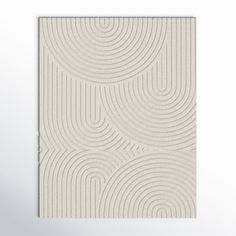 a white rug with wavy lines on it