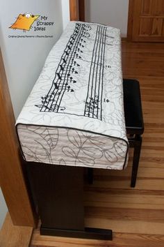 a bed sitting on top of a wooden floor next to a wall with writing on it