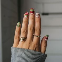 Sophisticated christmas nail design ideas featuring poinsettias and glitter Christmas Nails Acrylic