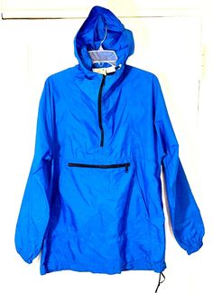 VINTAGE KELTY HOODED  NYLON ANORAK, ROYAL BLUE MADE IN THE USA LARGE KANGAROO FRONT POCKET FRONT ZIP POCKET POCKETS ARE IN GOOD WORKING CONDITION HOOD AND BOTTOM DRAWCORD ADJUSTMENTS MEDIUM  UNDERARM TO UNDERARM 23.5 SLEEVE 25 BETWEEN SHOULDER SEAMS 17 SHOULDER TO BOTTOM 32.5 GREAT PREOWNED CONDITION PLEASE LOOK AT ALL PHOTOS  AND ASK ANY QUESTIONS BEFORE BIDDING SHIPPING WILL BE WITHIN 1 BUSINESS DAY OF RECEIVING A VERIFIED PAYMENT. PAYMENT IS DUE WITHIN 3 DAYS OF THE END OF THE AUCTION. ANY PR Blue Hooded Raincoat With Adjustable Hood, Blue Nylon Windbreaker With Adjustable Hood, Blue Long Sleeve Raincoat With Adjustable Hood, Blue Hooded Windbreaker With Drawstring, Blue Windbreaker With Pockets For Hiking, Blue Nylon Long Sleeve Raincoat, Blue Hiking Windbreaker With Pockets, Casual Blue Raincoat With Pockets, Blue Hooded Raincoat For Streetwear