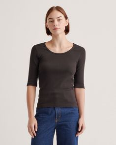 Everyday style gets an upgrade with our Organic Cotton Micro-Rib Elbow Sleeve Tee. Made from premium organic cotton, this tee offers unbeatable comfort and an always-flattering fit. Its micro rib adds a touch of texture while the classic silhouette means endless outfit options. Pair it with high-waisted jeans for an effortless look or layer it under a blazer for a little more polished. Quince Tops, Outfit Options, Kick Flare Jeans, High Neck Sleeveless, Kick Flares, Sleeveless Bodysuit, Just Run, Elbow Sleeve, Classic Silhouette