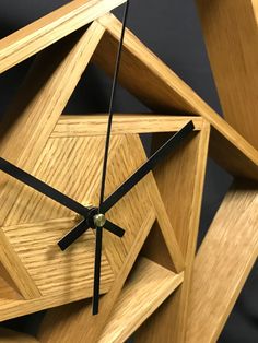 a clock made out of wood with black hands