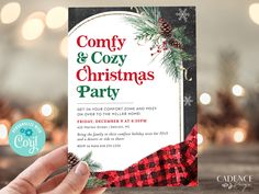 a hand holding up a christmas party card with pine cones and plaid ribbon on it