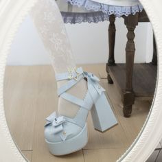 Elevate your style with our Blue Kawaii Lolita Bow Star Chunky Platform High Block Heels. Crafted from glossy blue patent leather, these statement heels feature charming bow details at the front and back, complemented by a star-shaped metal buckle. The high block heel and chunky platform offer both height and comfort, making them perfect for coquette, kawaii, Lolita, or pastel fashion enthusiasts. Glossy blue patent leather for a vibrant, luxurious look Bow details at the front and back for added charm Star-shaped metal buckle for a playful touch High block heel and chunky platform for height and comfort Ideal for coquette, kawaii, Lolita, and pastel aesthetics Summer Harajuku High Heels, Harajuku High Heels For Summer, Harajuku Style Heels For Summer Parties, Cute Bow Heels With Round Toe, Cute Heels With Bow And Round Toe, Cute Round Toe Heels With Bow, Cute Closed Toe Heels With Bow, Harajuku Ankle Strap Heels For Party, Harajuku Style Platform Party Heels