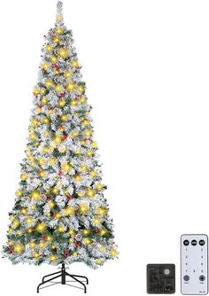 a white christmas tree with lights and remotes