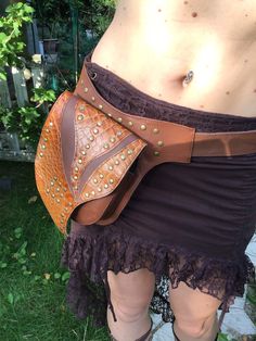 Very comfortable and functional Available in 2 duo tones,ochre-light brown or beige-brown. Decorated with copper-tone rivets and reptile printed details. Adjustable in size with a buckle Waist: 70 till 110cm/ 27 till 43 inches,wide:3,5cm/1.4 inches Frontpocket 15x14 cm/5.9x5.5 deep 3.5cm/1.4 inches magnetic lock and zip lock. Inside;Extra zip pocket same size,also with zipper. Perfect for travelling, festivals or just everyday life and for the ones that don't like carrying a bag or loose and for Ochre Lighting, Leather Hip Bag, Duo Tone, Leather Leaf, Magnetic Lock, Thanks For The Gift, Utility Belt, Funky Fashion, Black Fringe