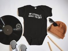 "\"I'm Literally About To Cry\" Baby Bodysuit/Onesie - a cute and trendy design that lets everyone know your toddler's true feelings. 🖤 Our bodysuits are handmade! 🖤 Crafted with pure passion and anarchy, each bodysuit is custom bleach-dyed to absolute perfection. Please allow for some variation between products because of this. The one you receive may not look exactly like the listing, but that's okay! It just means that these babies are one-of-a-kind, like your own little bundle of mayhem. N Rock And Roll Baby Gifts, Band Tee Onesie, Punk Rock Baby, Punk Rock Baby Clothes, Cute Baby Onesies, Punk Baby, Funny Baby Onesies, True Feelings, Baby Mama