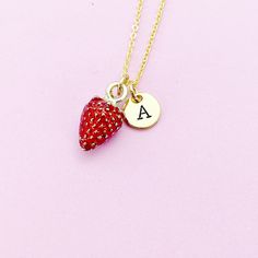 This is gold tone Strawberry charm with hand stamped initial charm on brass or stainless-steel chain. ♥ You will receive one necklace. HOW TO ORDER 1) Choose the quantity. 2) Choose the initial in the option or add a note to seller at checkout. 3) Add to the cart. DESCRIPTION ♥ Necklace, Stainless Stee Chain with Lobster Claw Clasp, Size: about 17.7 inches (45cm) long, 1-2mm wide, Nickel Safe, *stainless steel is durable, highly resistant to rust and corrosion. OR ♥ Necklace, Real 18K Gold Plate Personalized Brass Jewelry For Valentine's Day, Gold Hand Stamped Charm Necklace For Valentine's Day, Personalized Red Dangle Jewelry, Personalized Dangle Charm Necklaces For Valentine's Day, Personalized Brass Necklace For Valentine's Day, Valentine's Day Personalized Brass Necklace, Red Initial Pendant Jewelry For Gift, Red Initial Pendant Jewelry Gift, Red Initial Pendant Jewelry As A Gift