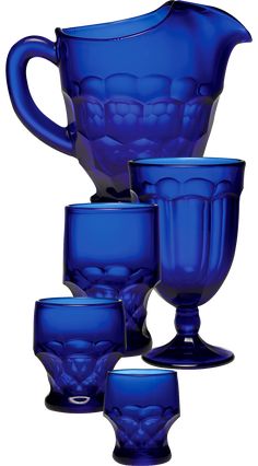 a blue glass pitcher and six glasses