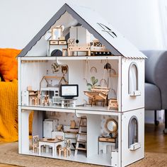 a doll house with furniture and accessories in it