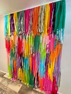 colorful streamers hanging on the wall in an office