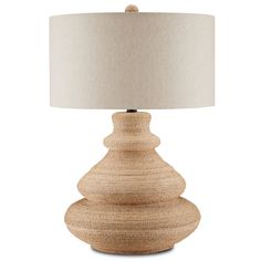 a wooden table lamp with a white shade on the base and a beige linen lampshade