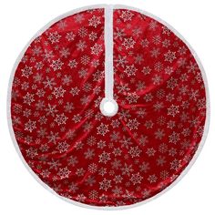 a red and white christmas tree skirt with snowflakes on the bottom, in front of a white background