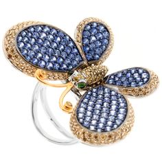 Show off your sense of style and whimsy with Zorab's playful butterfly cocktail ring meticulously hand-crafted with 4.56 Carat of Blue Sapphire, 1.74 Carats of treated Brown Diamonds, 0.40 Carats of Yellow Diamonds and 0.20 Carats of Tsavorite Garnet. Its Whimsical Wings Flutter and Move while its adorned on your finger. This item has a serial number and bears the stamp of authenticity from Zorab Creation. Ring Size 8.50 Luxury Butterfly Ring For Formal Occasions, Luxury Diamond Butterfly Ring, Luxury White Gold Butterfly Ring, Luxury Butterfly-shaped Ring For Gift, Luxury Butterfly Ring For Gift, Diamond Butterfly Ring With Gemstone For Formal Occasions, Luxury Butterfly Rings For Gifts, Luxury Butterfly Rings For Gift, Formal Diamond Butterfly Ring With Gemstone