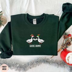 **Please message us if you would like to order youth/kids sweatshirts. Content + Care -Machine wash cold and tumble dry low Size + Fit -True To Size Fit (American Uni-Sex Sizes for T-Shirts) -Available in baby 3month-18 months, toddler 2t-5t, youth small-XL, and adult sizes small, medium, large, x-large, 2x-large, and 3x-large Processing + Shipping Your order will ship out in 2-5 days. Please allow 1-2 days for processing. Most orders are delivered in 7-10 business days. Refunds + Exchanges We k Minimal Christmas, Christmas Crewneck, Winter Shirts, Holiday Sweatshirt, Gildan Sweatshirts, Christmas Hoodies, Holiday Shirts, Military Green, Crewneck Sweater