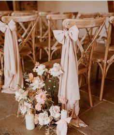 the chairs are decorated with flowers and candles