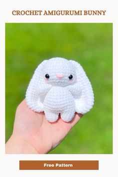 a crochet amigurmi bunny sitting on someone's hand