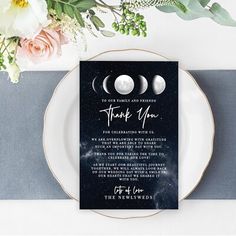 a plate with some flowers on it next to a card that reads thank you for celebrating with us