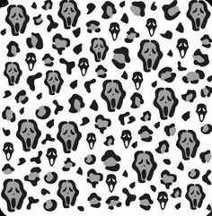 a black and white pattern with skulls on it's back ground, in the shape of a square