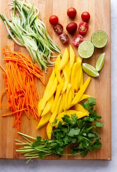 vegetables are cut up on a cutting board